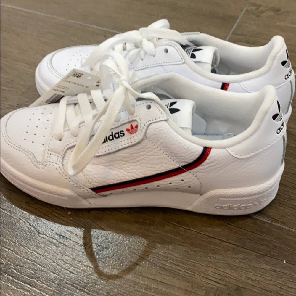 Adidas white sneakers.
